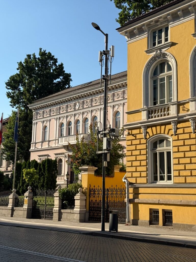 Pastel-coloured 19th-century buildings on a quiet Sofia street